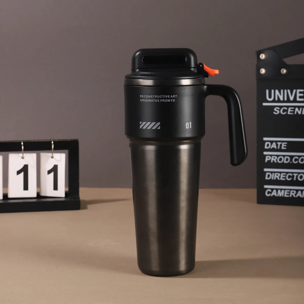 Robo-armor-style portable insulated cup with built-in sport mode quick-open straw and car-mounted ice maker