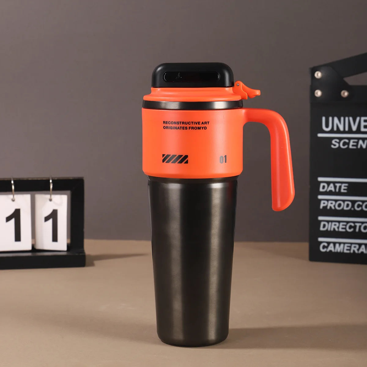 Robo-armor-style portable insulated cup with built-in sport mode quick-open straw and car-mounted ice maker